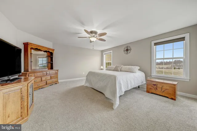 a view of a table and chairs in the garden