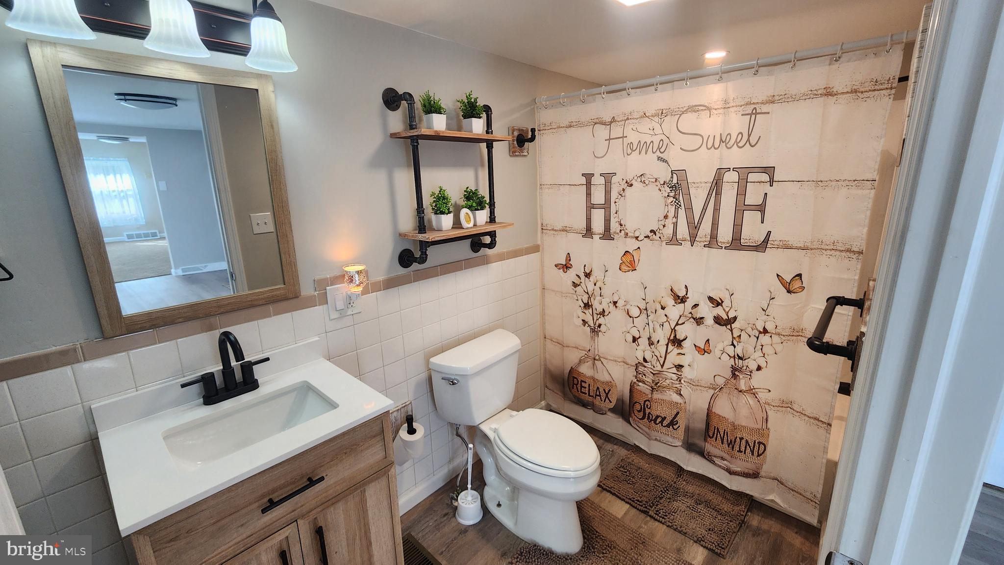 617 Lower Mill Road Pittsgrove, NJ 08318 - Photo 11 of 12 a bathroom with a sink toilet and shower
