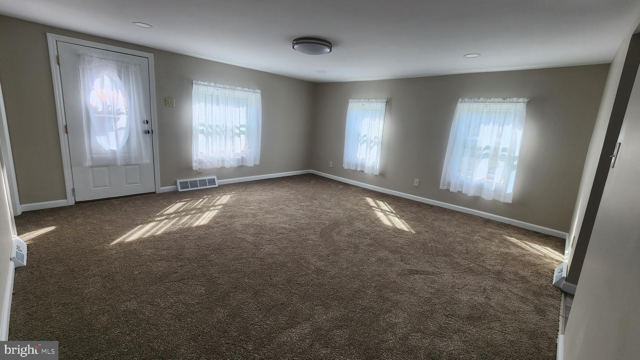 617 Lower Mill Road Pittsgrove, NJ 08318 - Photo 5 of 12 a view of empty room with windows