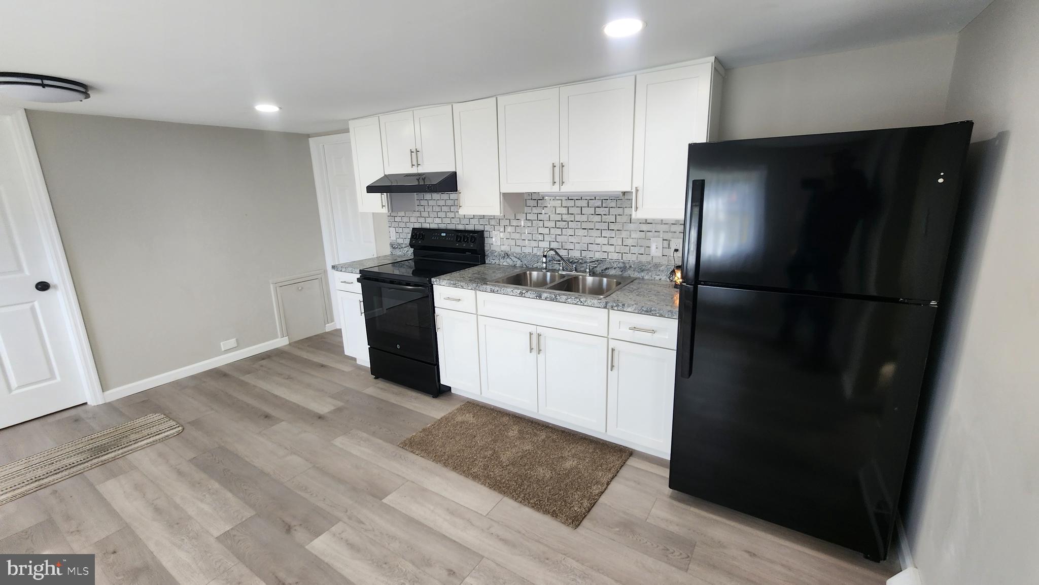 617 Lower Mill Road Pittsgrove, NJ 08318 - Photo 8 of 12 a kitchen with a refrigerator and a stove