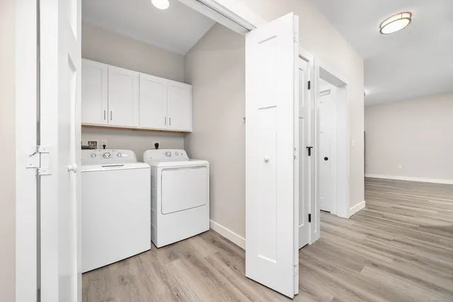 a view of utility room with wooden floor