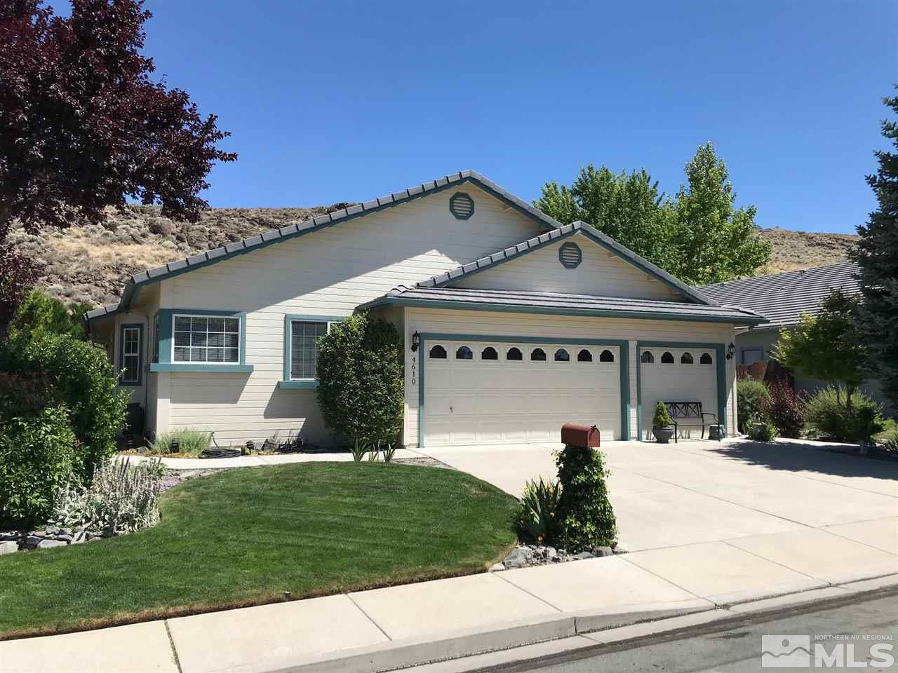 4610 Goodwin Road Sparks, NV 89436 - Photo 1 of 31 a front view of a house with a yard