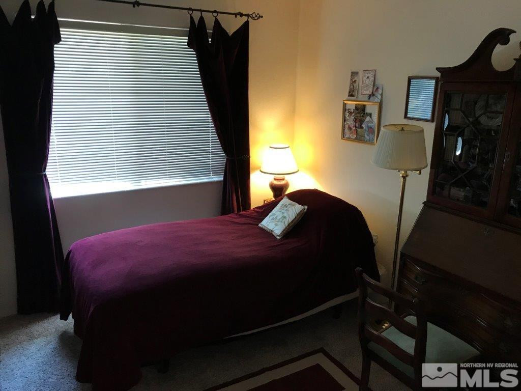 4610 Goodwin Road Sparks, NV 89436 - Photo 15 of 31 a bedroom with a bed and a window