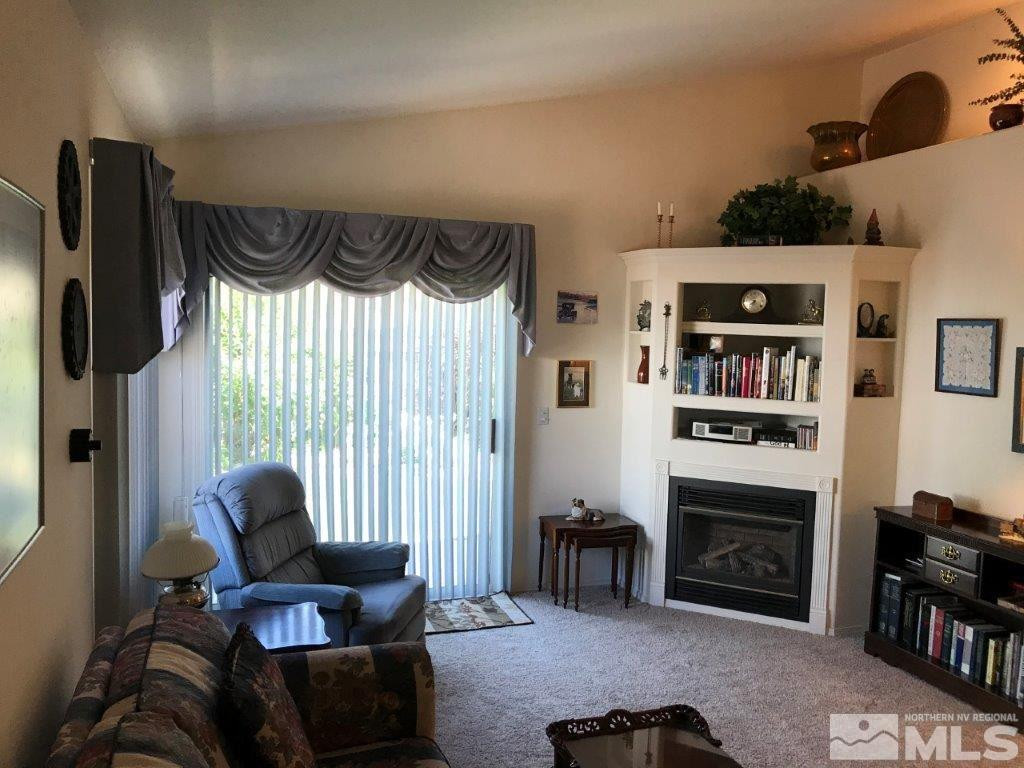 4610 Goodwin Road Sparks, NV 89436 - Photo 2 of 31 a living room with furniture and a fireplace