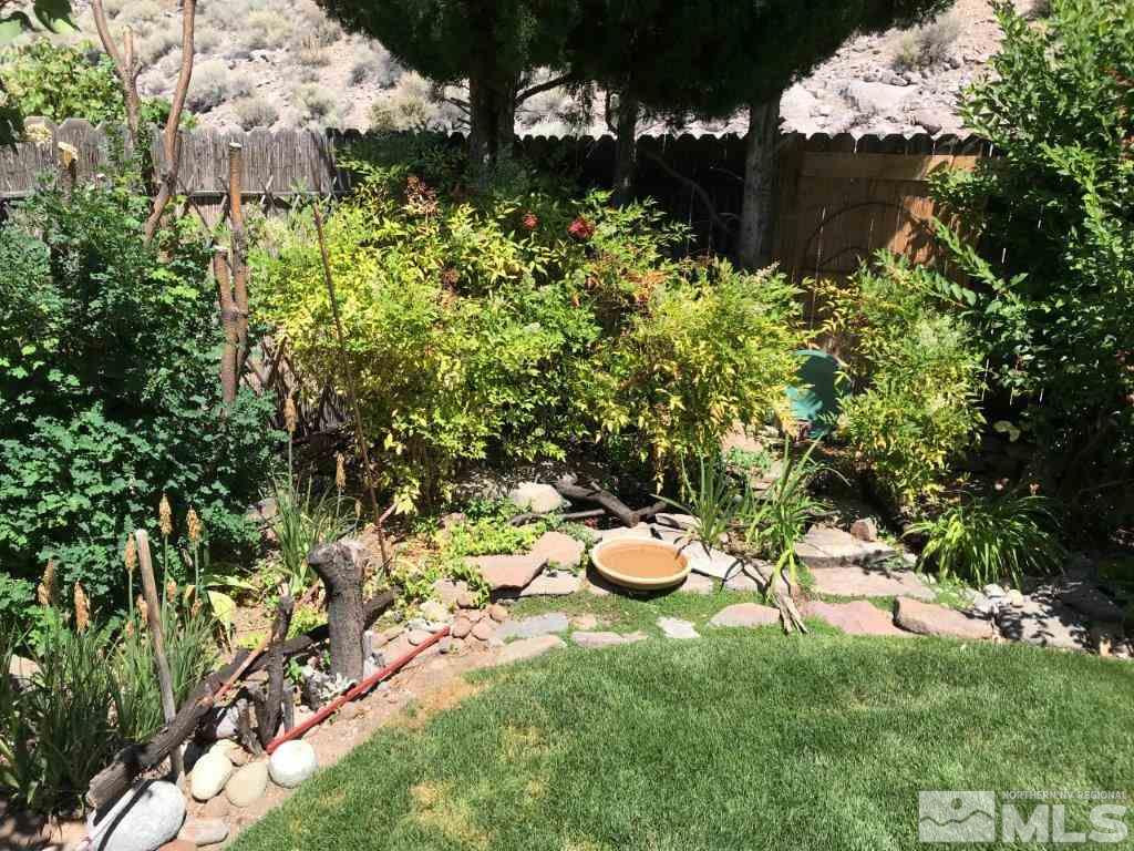 4610 Goodwin Road Sparks, NV 89436 - Photo 24 of 31 a view of a backyard with plants and outdoor seating
