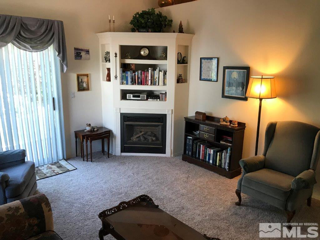 4610 Goodwin Road Sparks, NV 89436 - Photo 4 of 31 a living room with furniture and a fireplace