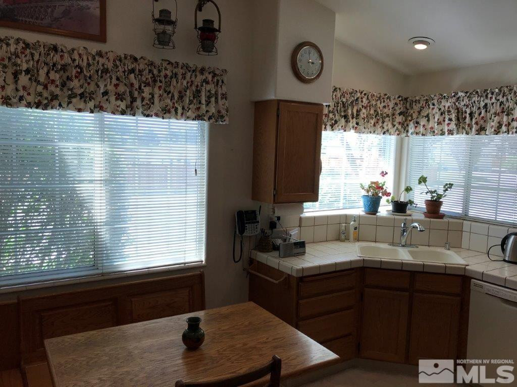 4610 Goodwin Road Sparks, NV 89436 - Photo 8 of 31 a kitchen with a sink cabinets and window
