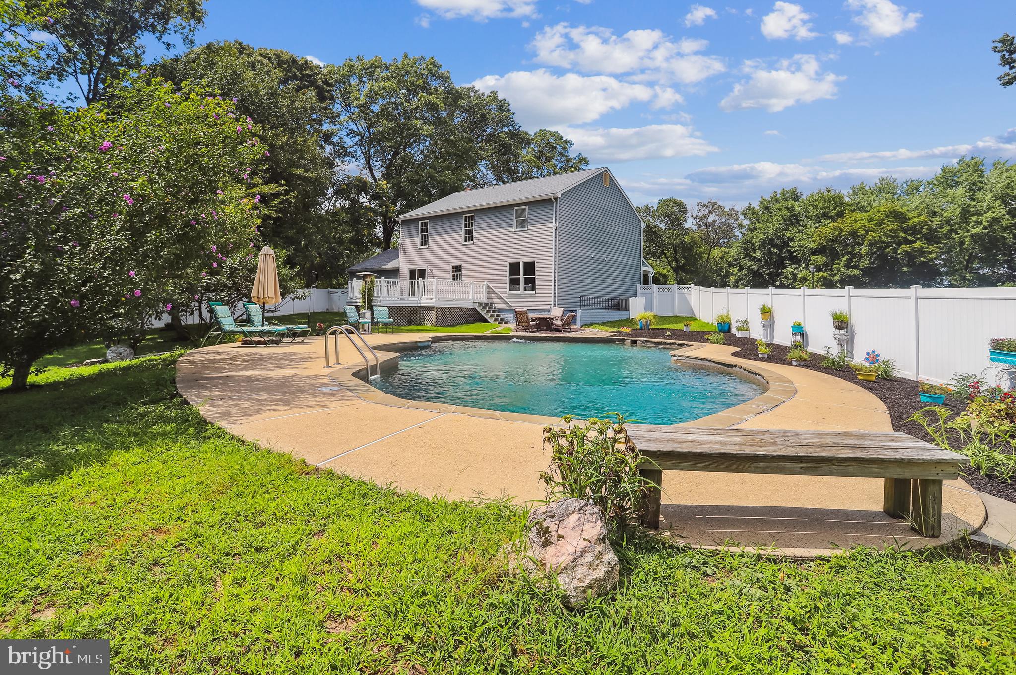 735 Evergreen Road Severn, MD 21144 - Photo 35 of 47 a view of backyard with swimming pool and outdoor seating