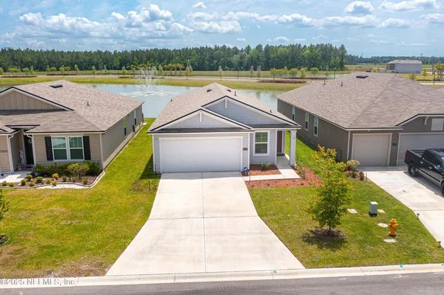 a view of a swimming pool with lounge chair