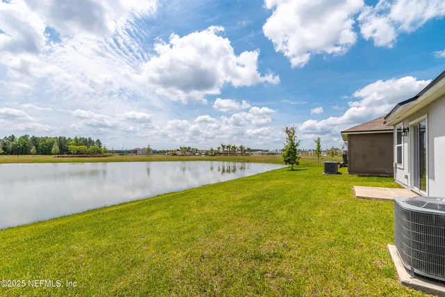 a view of a lake with a big yard