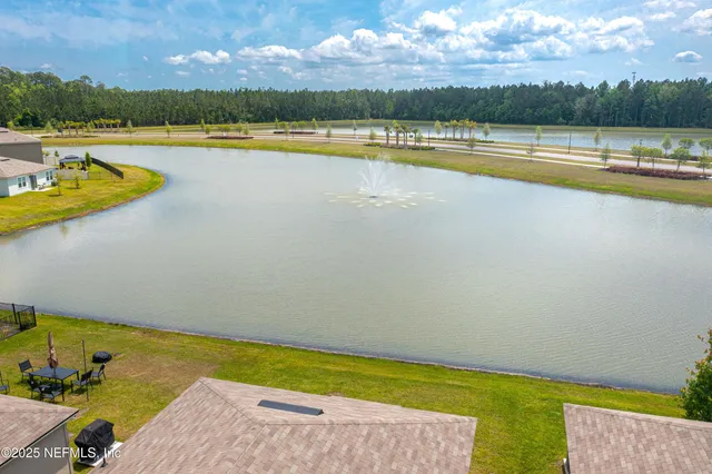 a view of a swimming pool and an outdoor seating