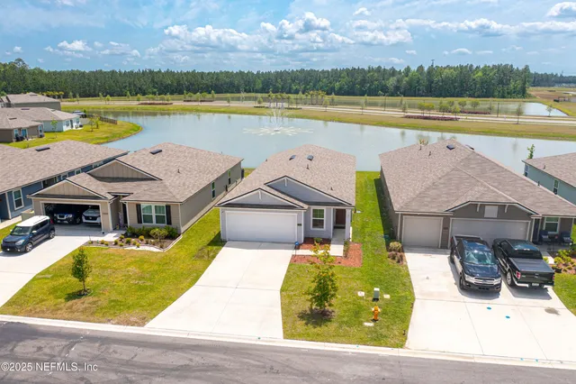 a view of a swimming pool and lounge chair