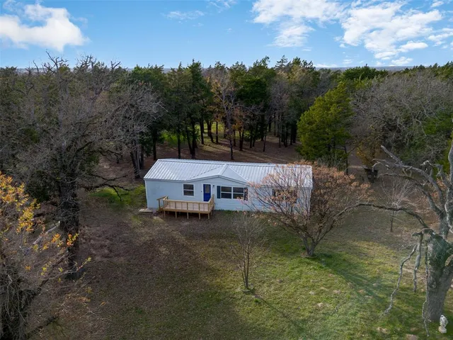 a house that is sitting in the forest