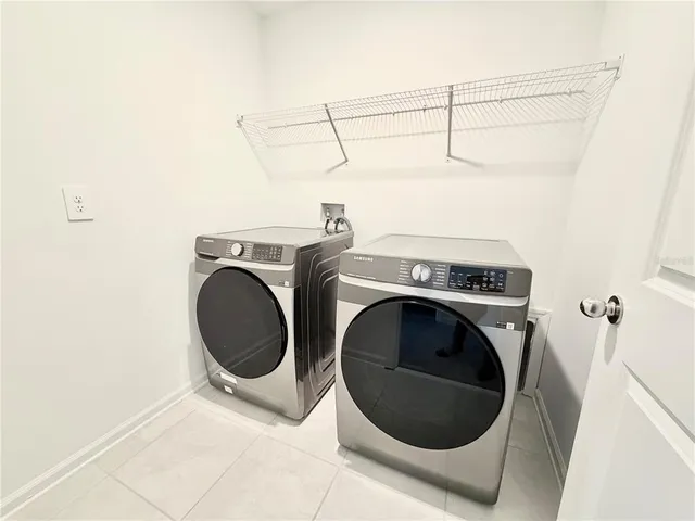 a utility room with dryer and washer