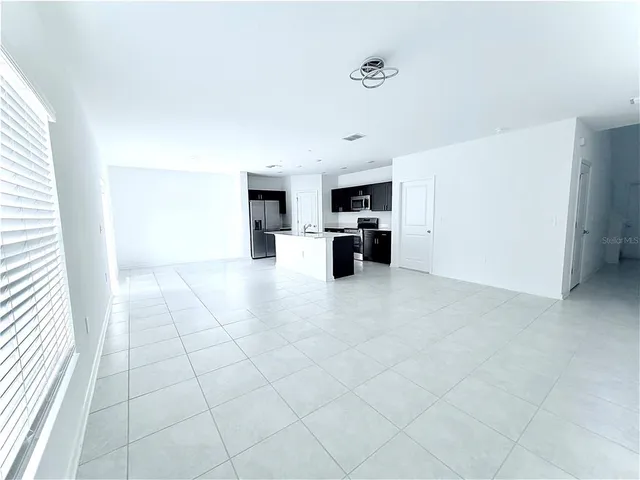 a view of kitchen with furniture and window
