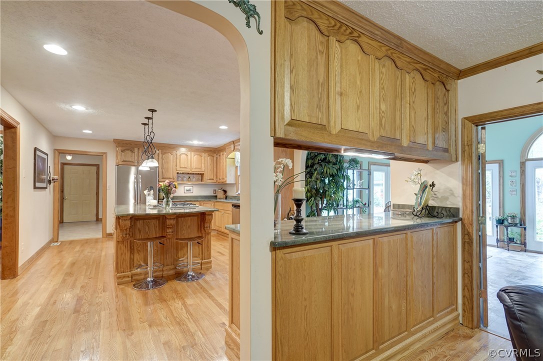 9610 Old Forge Road Providence Forge, VA 23140 - Photo 12 of 44 a kitchen with stainless steel appliances granite countertop a refrigerator a sink dishwasher and a stove with wooden floor