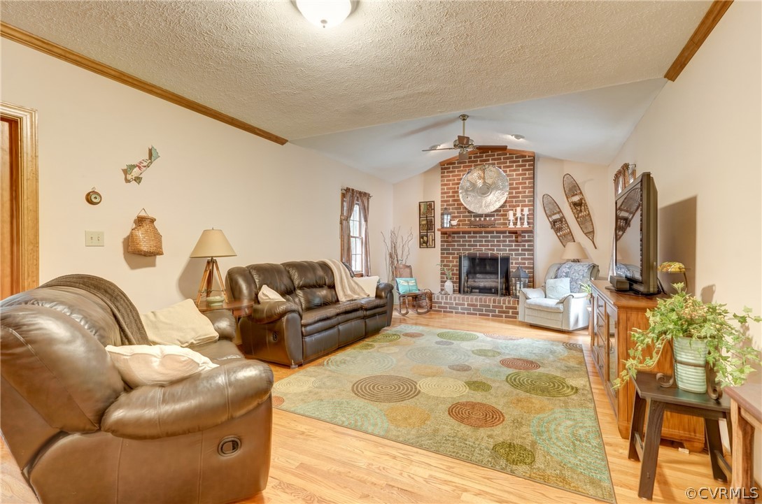 9610 Old Forge Road Providence Forge, VA 23140 - Photo 13 of 44 a living room with furniture a fireplace and a fireplace