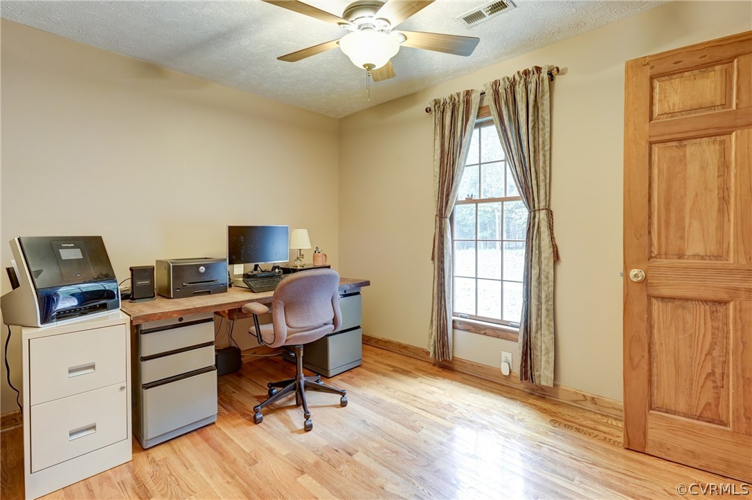 9610 Old Forge Road Providence Forge, VA 23140 - Photo 25 of 44 a view of a workspace with furniture and a window