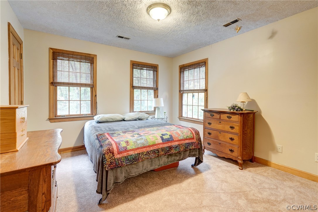 9610 Old Forge Road Providence Forge, VA 23140 - Photo 34 of 44 a bedroom with a bed and a window