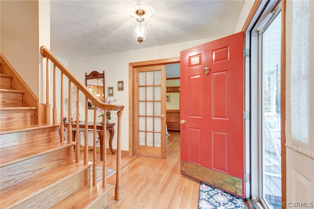 9610 Old Forge Road Providence Forge, VA 23140 - Photo 7 of 44 a view of entryway with wooden floor and stairs