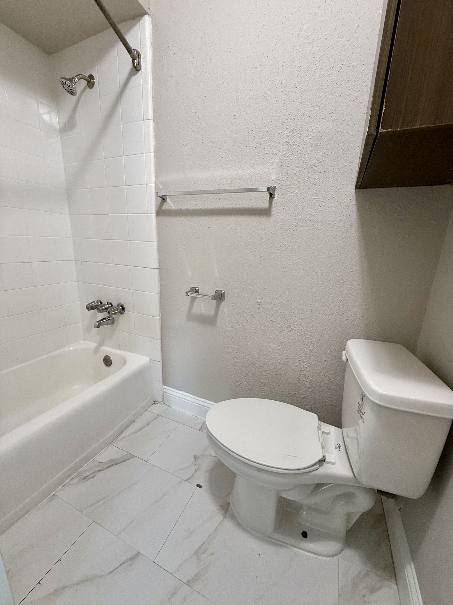 1518 Wirt Road, Unit 6 Houston, TX 77055 - Photo 12 of 14 a white toilet sitting next to a bath tub
