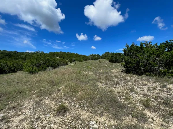 a view of mountain with sunset