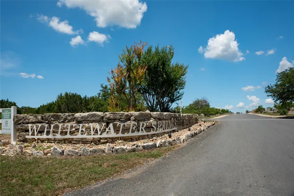a view of a lake with a yard