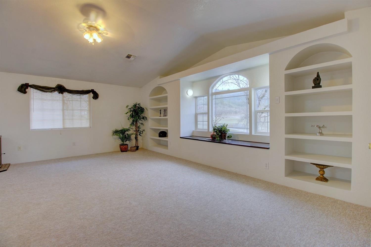 16565 Shiloh Road White City, OR 97503 - Photo 8 of 19 wooden floor in an empty room with a window