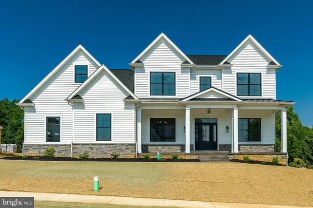 a view of a house with swimming pool and porch