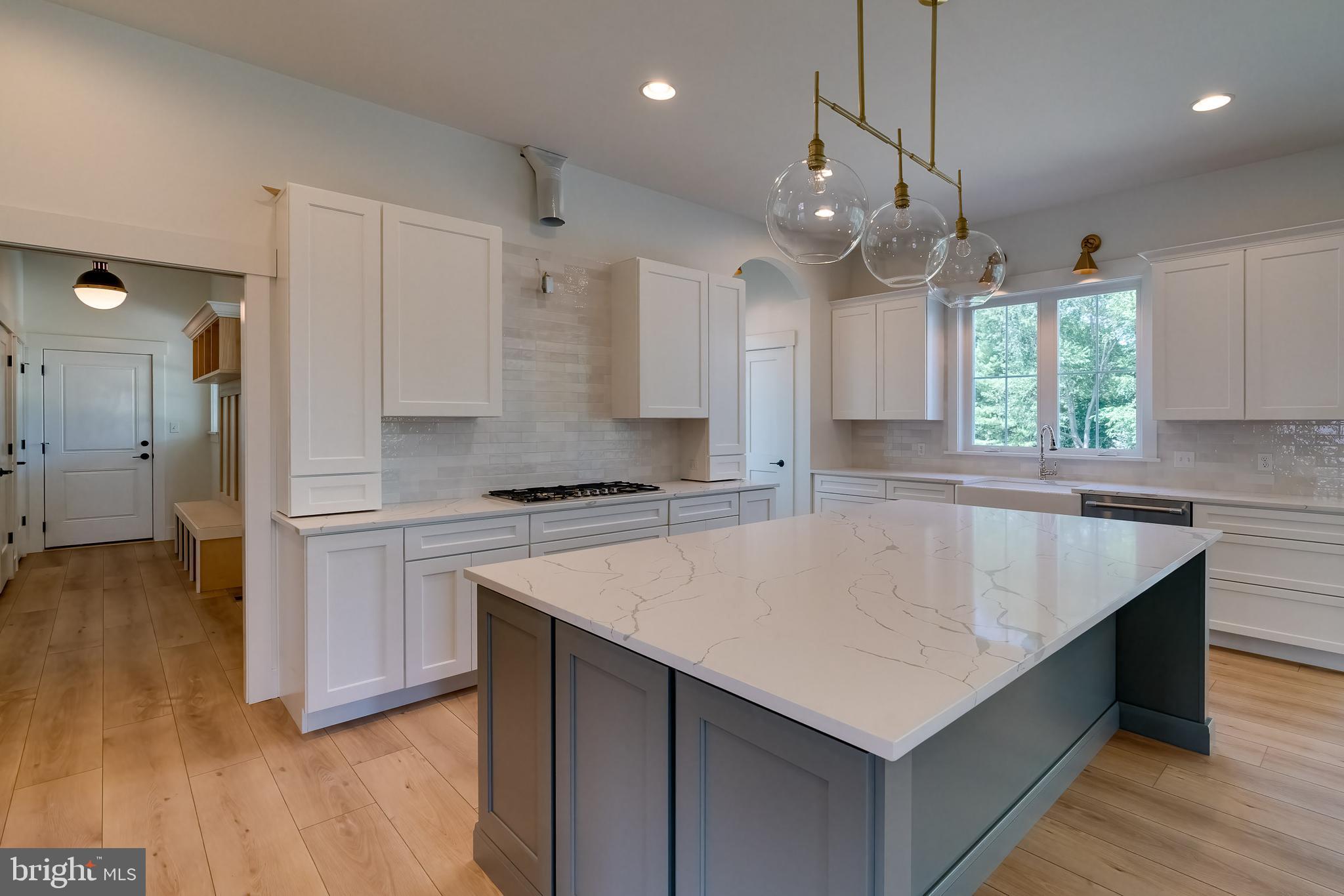 301 Fletcher Drive Lititz, PA 17543 - Photo 8 of 17 a kitchen with a refrigerator a sink and wooden floor