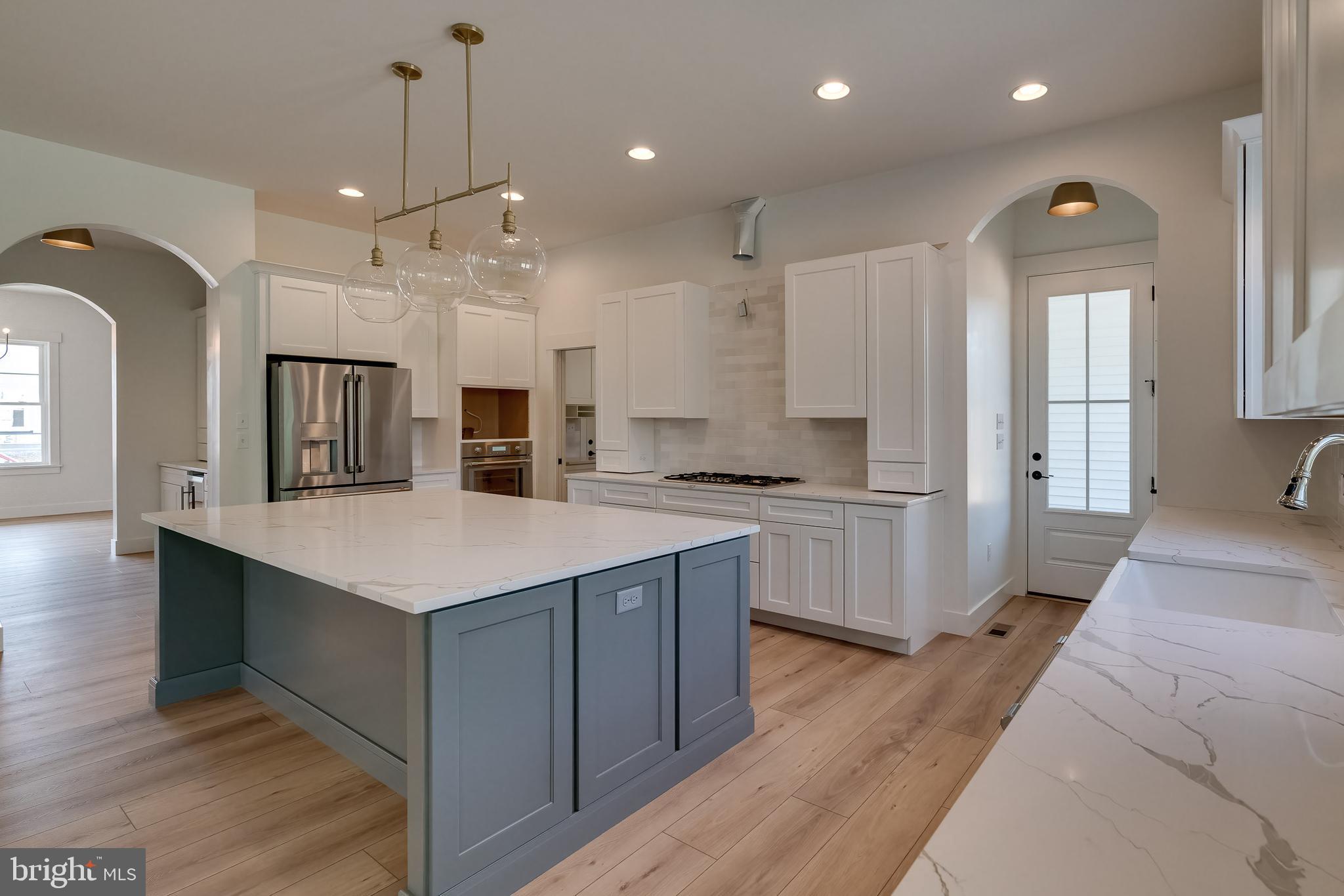 301 Fletcher Drive Lititz, PA 17543 - Photo 9 of 17 a large kitchen with a large counter top a sink stainless steel appliances and cabinets