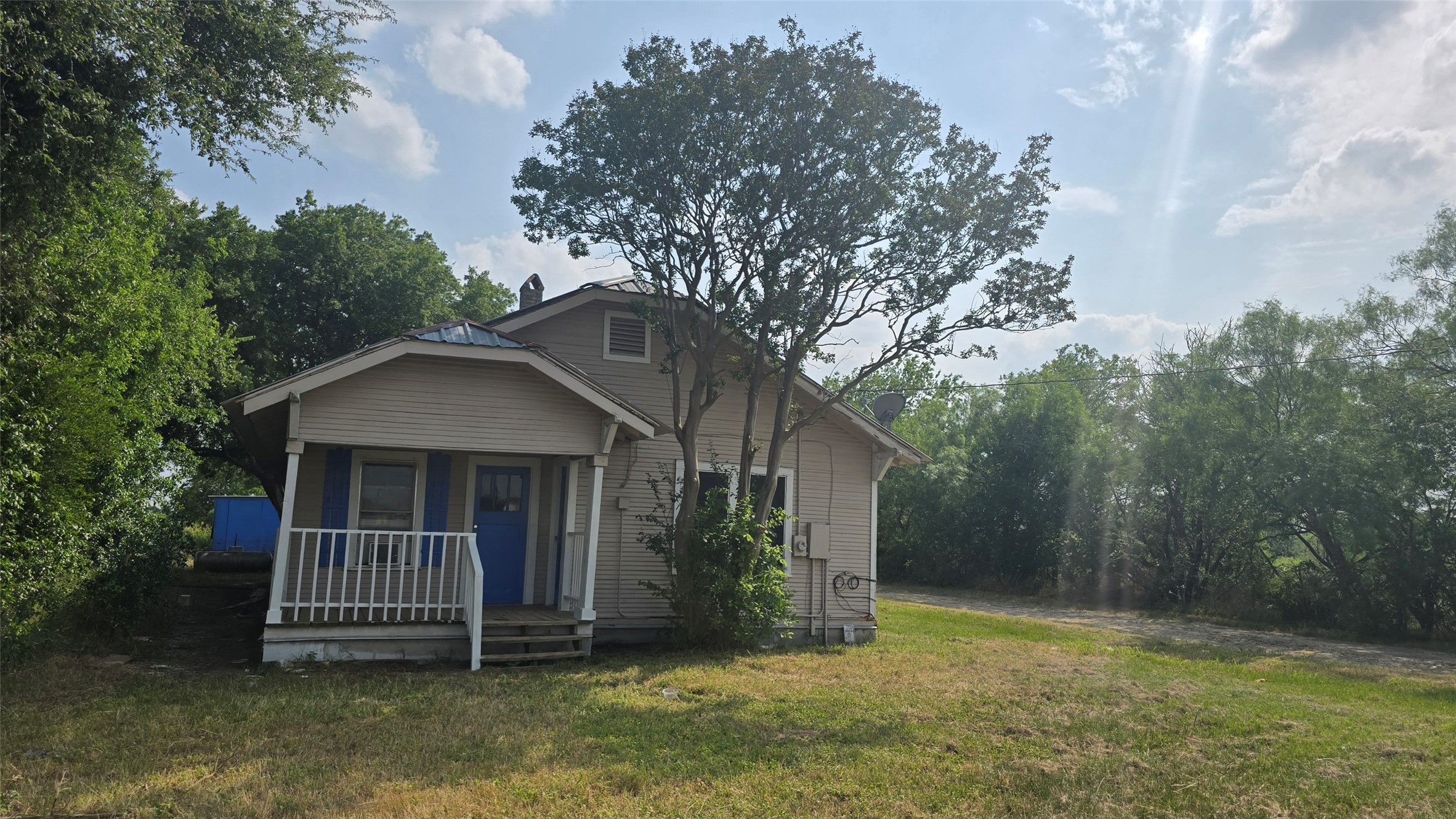 18327 Blake Manor Road, Unit A Manor, TX 78653 - Photo 1 of 21 Bungalow-style home with a porch and a front yard