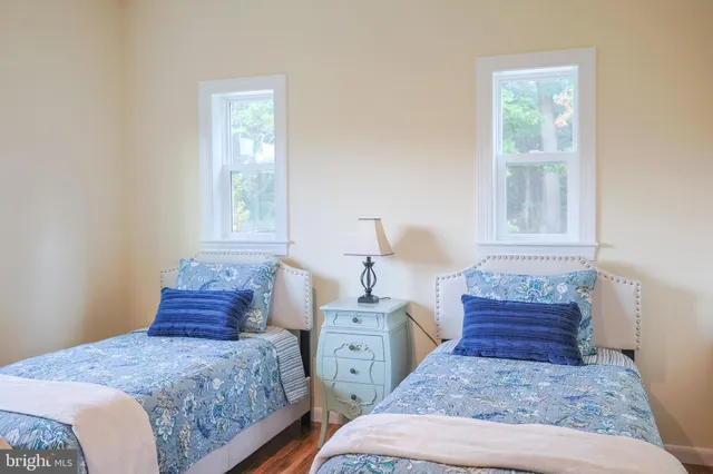 a view of balcony with wooden floor and lake view