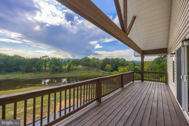 a view of a lake in between two chairs