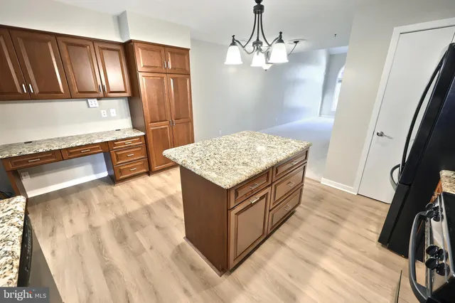 a bathroom with a sink a toilet a mirror and shower