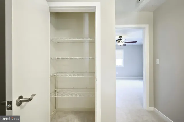 an aerial view of a house with a yard basket ball court and outdoor seating
