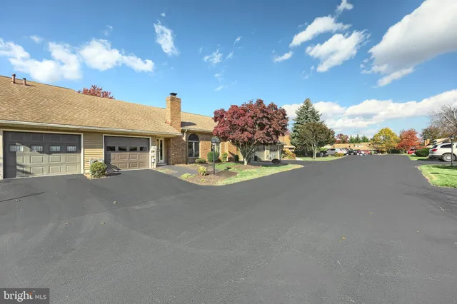 a view of a house with a street