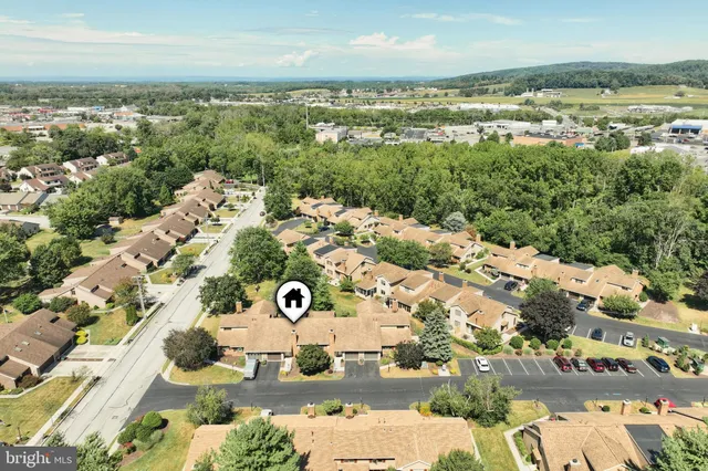 a view of a house with a yard and tree s