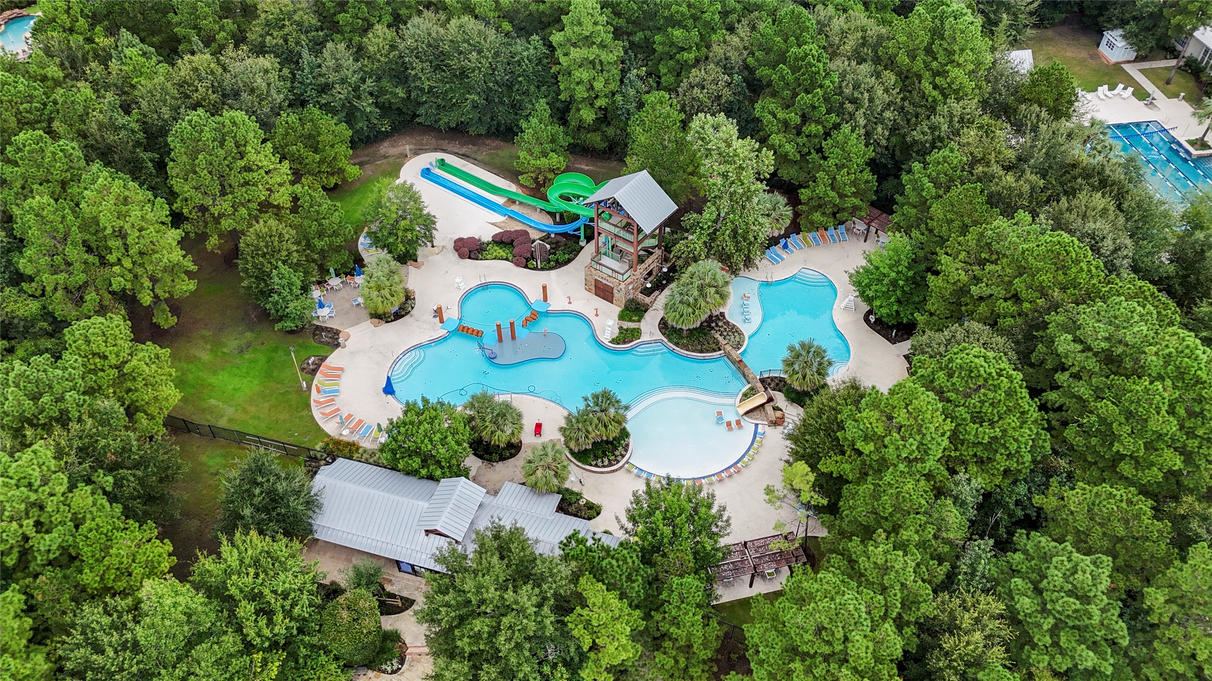 334 Topper Pines Drive Montgomery, TX 77316 - Photo 39 of 49 Forest Island is one of Woodforest’s signature amenity spaces, bringing resort-style pool days, splash areas, and shaded surroundings into the everyday rhythm of the community.