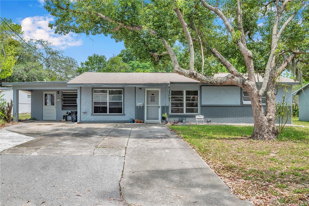 6900 Forest Avenue New Port Richey, FL 34653 - Photo 1 of 1 front view of a house with a yard