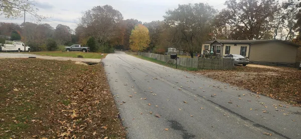 a view of a yard with a house