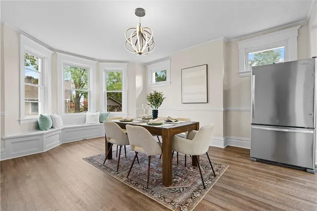 a view of a dining room with furniture window and wooden floor