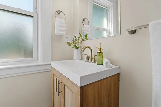 a bathroom with a sink and a mirror