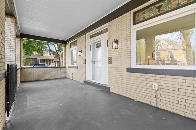 a view of an empty room with a fireplace