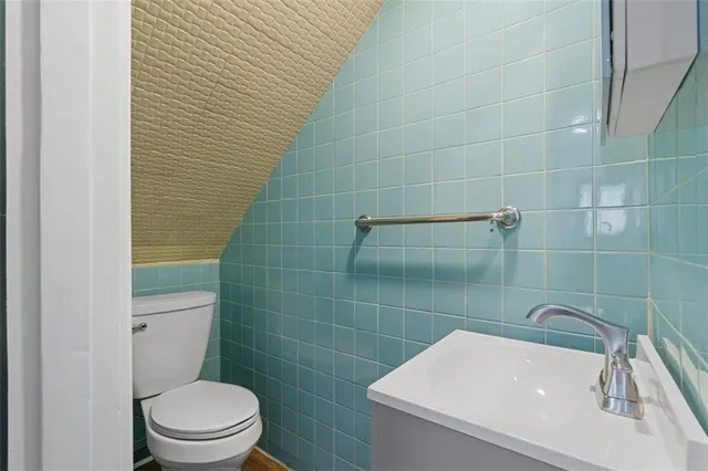 a bathroom with a sink and toilet