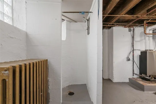 a view of walk in closet with clothes