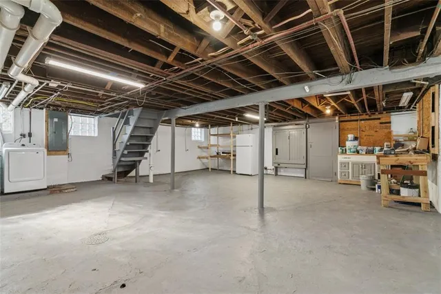 a view of empty room with wooden ceiling