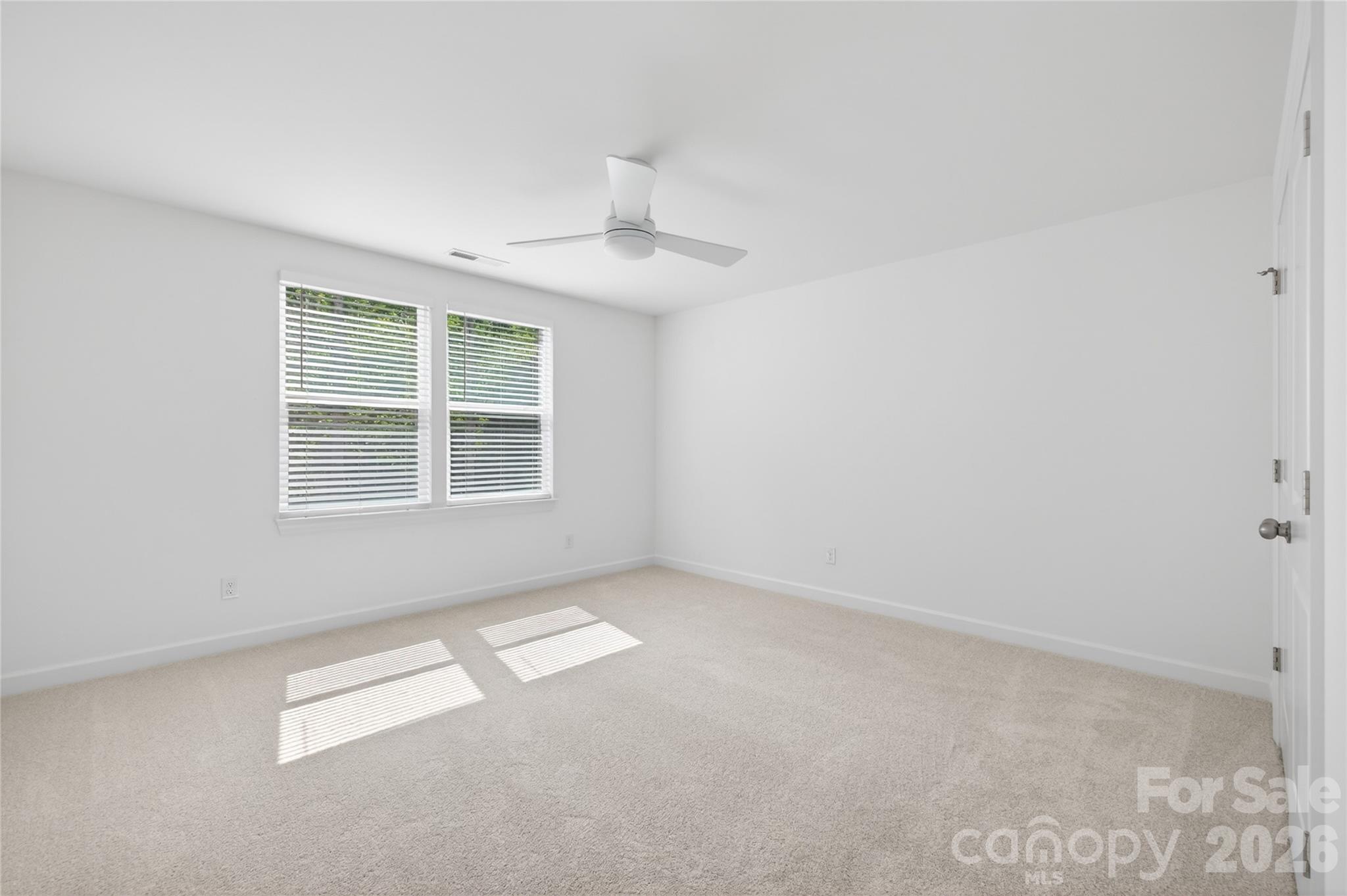 128 Overcash Road, Unit 7171 Troutman, NC 28166 - Photo 29 of 41 an empty room with windows
