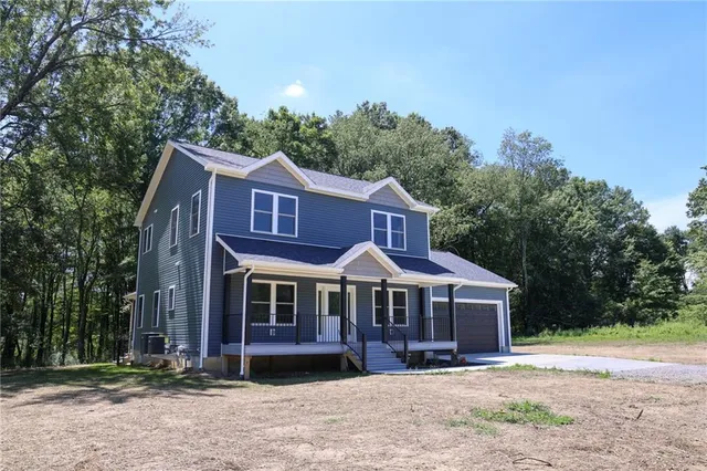a front view of a house with yard