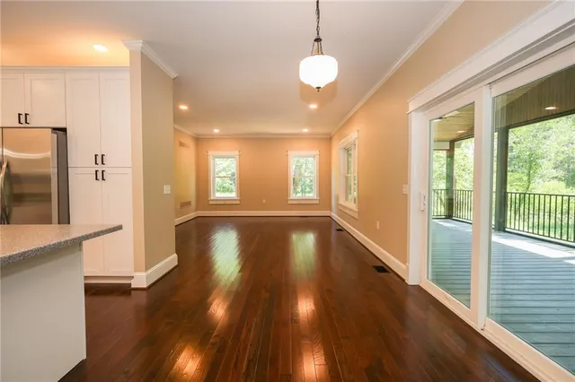 a view of an entryway with wooden floor